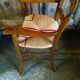 Child's high chair with a rush seat in walnut