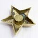 Star-shaped brass candle holder