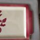 Cake dish bird pattern on its branch in red and white tones