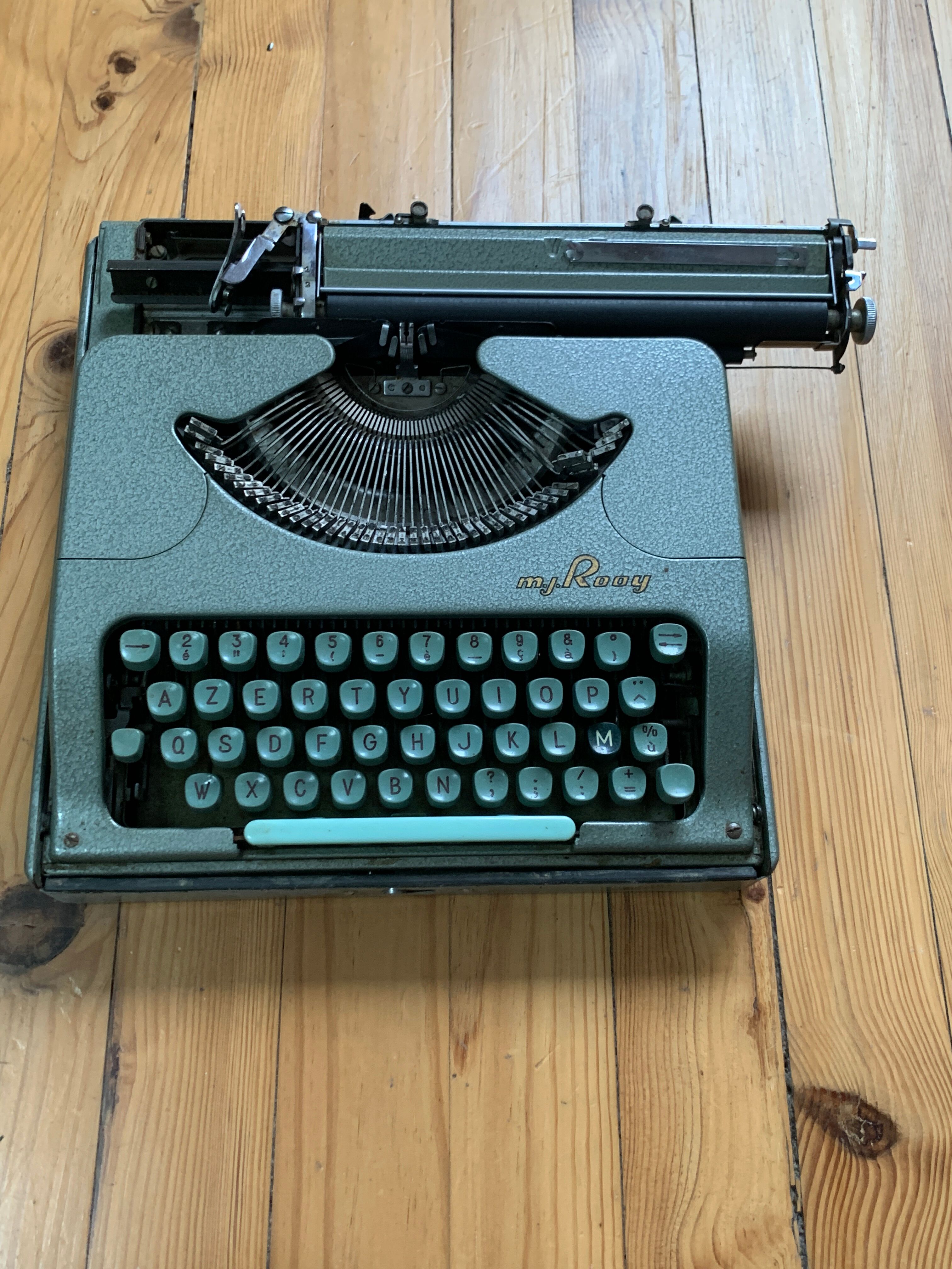 M.J. Rooy light green typewriter
