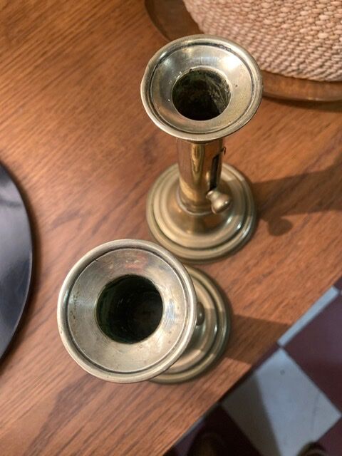 Pair of 19th-century brass pusher candlesticks