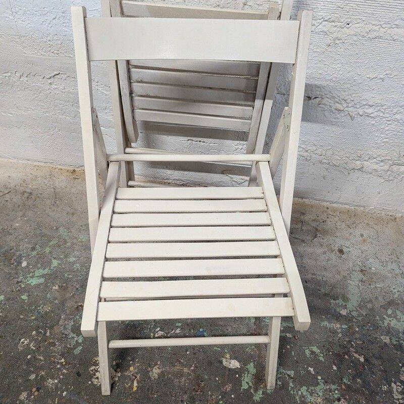 Pair of white wooden folding chairs