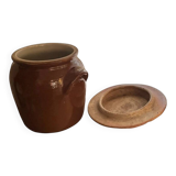 Ancient ceramic salt cellar and its lid.