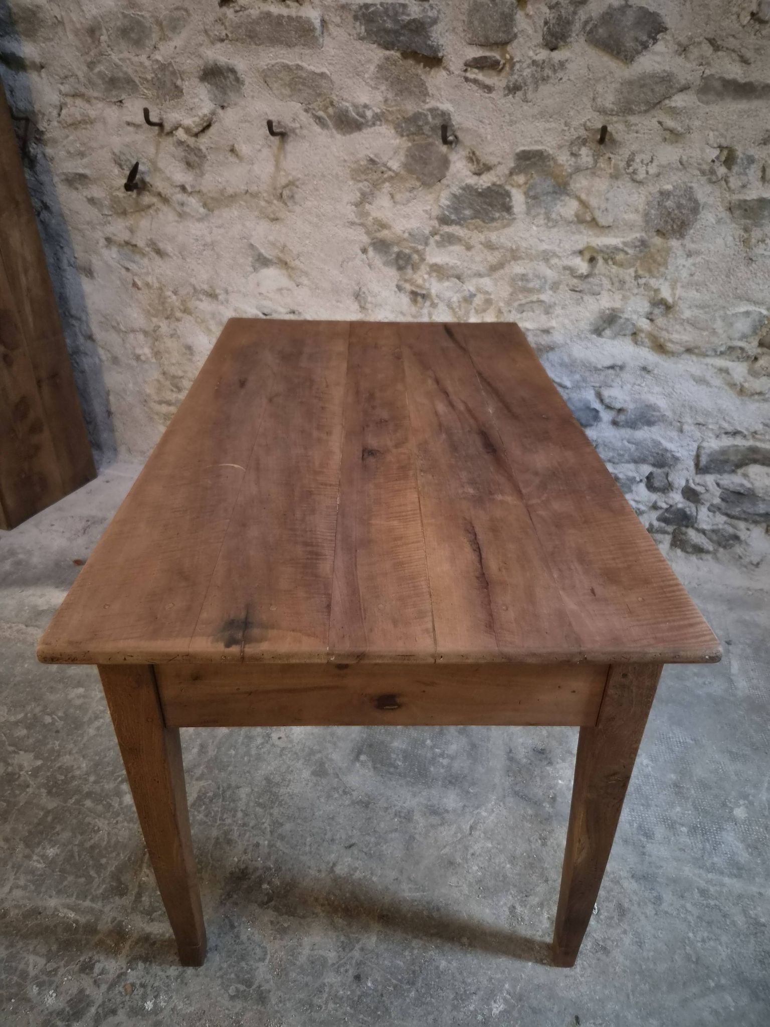 French antique dining table in cherry wood with two drawers, circa 1880–1920.