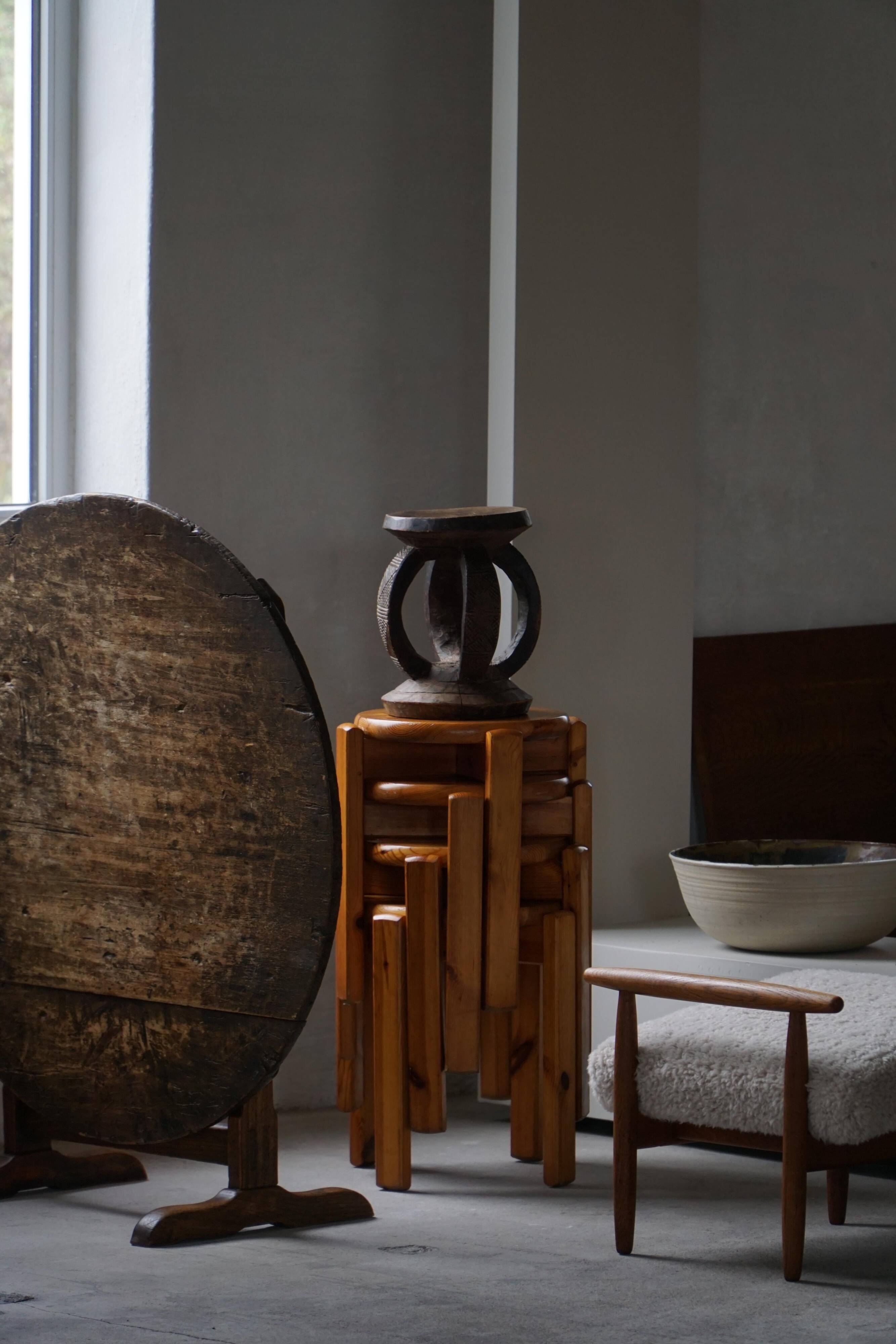 Antique wooden stool hand-carved by the Dogon people of Africa, Wabi-Sabi style, mid-20th century.