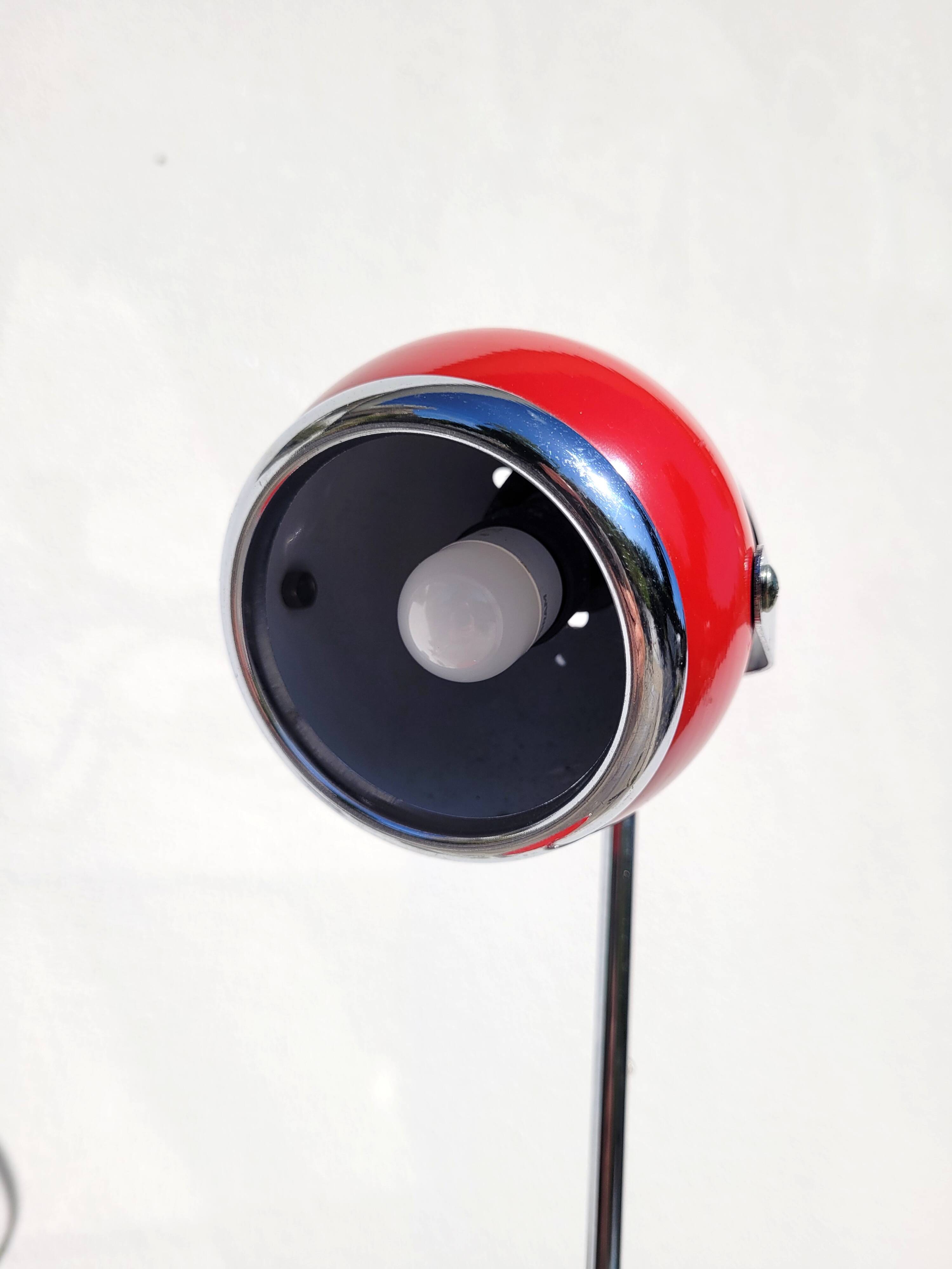 Red and chrome eyeball lamp