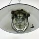 Black enamel and cast iron industrial cage pendant lamp, 1950