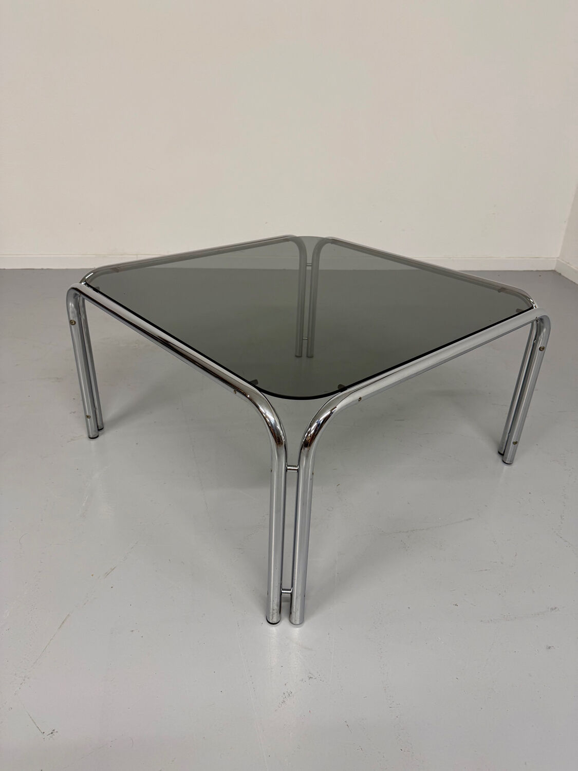 Space coffee table from the 70s, tubular metal and vintage smoked glass