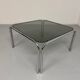 Space coffee table from the 70s, tubular metal and vintage smoked glass