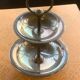 Double cup display in vintage silver metal