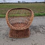 Old throne basket armchair in woven wicker