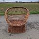 Old throne basket armchair in woven wicker