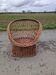 Old throne basket armchair in woven wicker