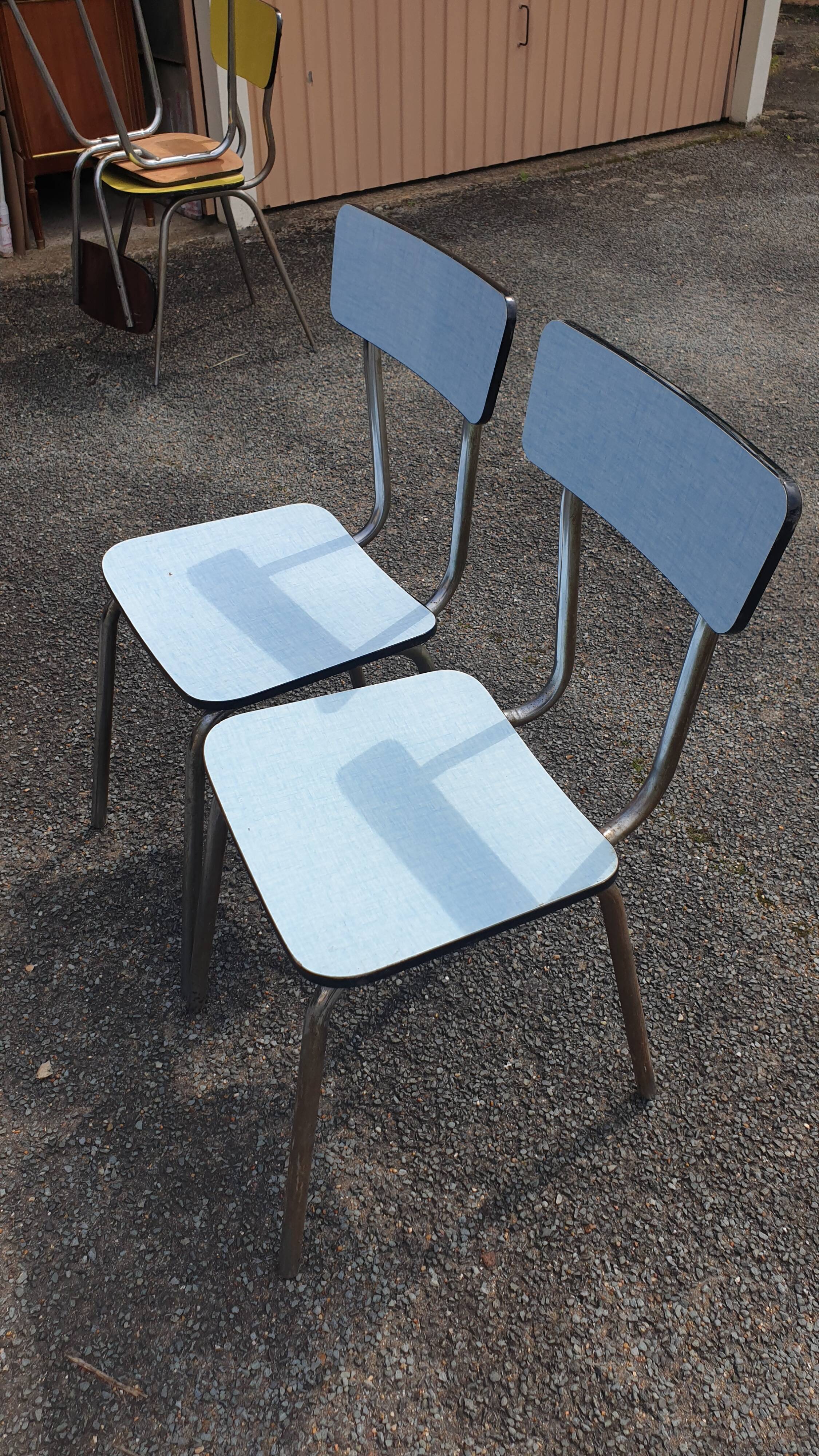 2 sky blue Formica chairs