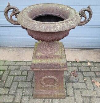 Cast iron garden urn on pedestal with handles
