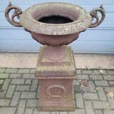 Cast iron garden urn on pedestal with handles