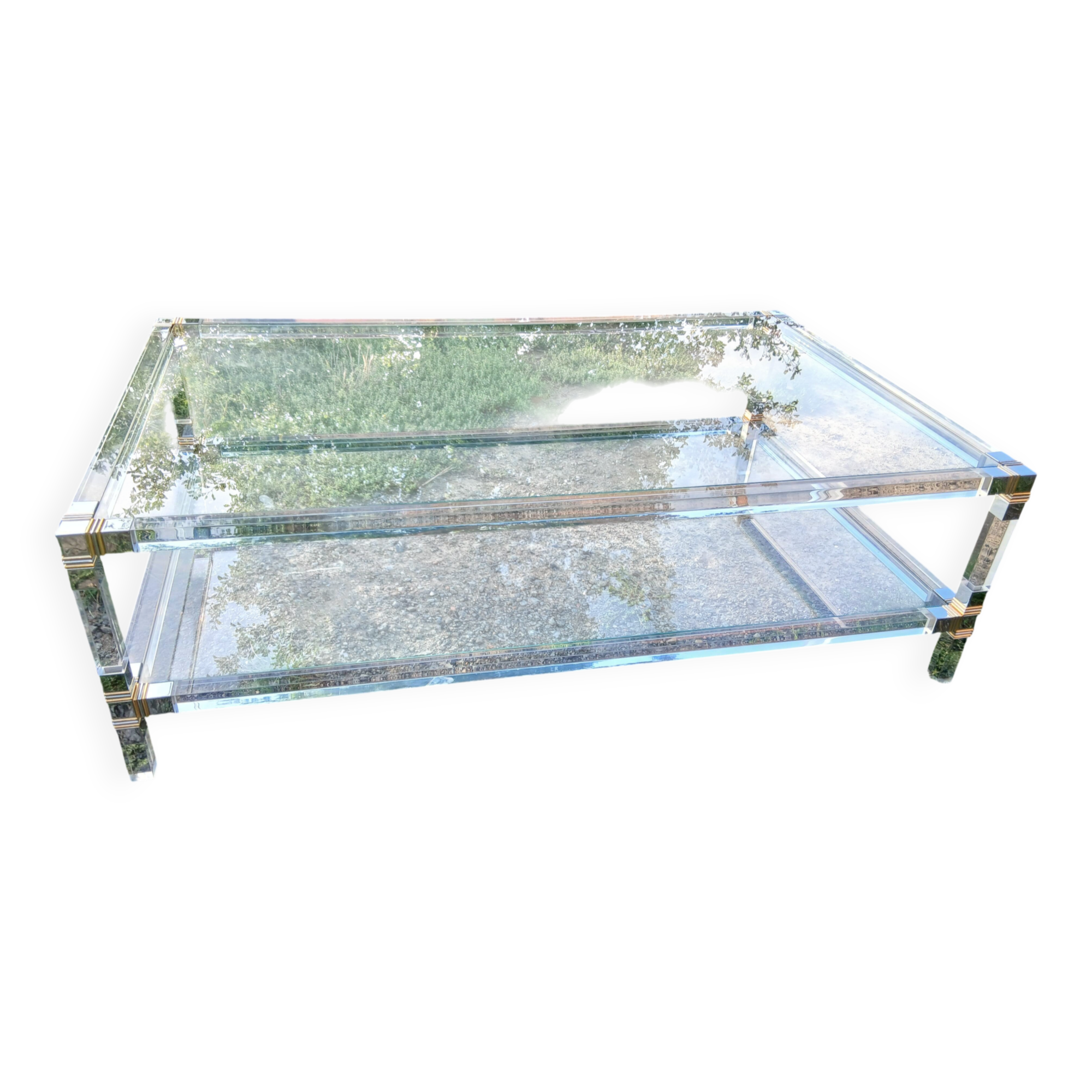 Coffee table in plexiglass and brass.