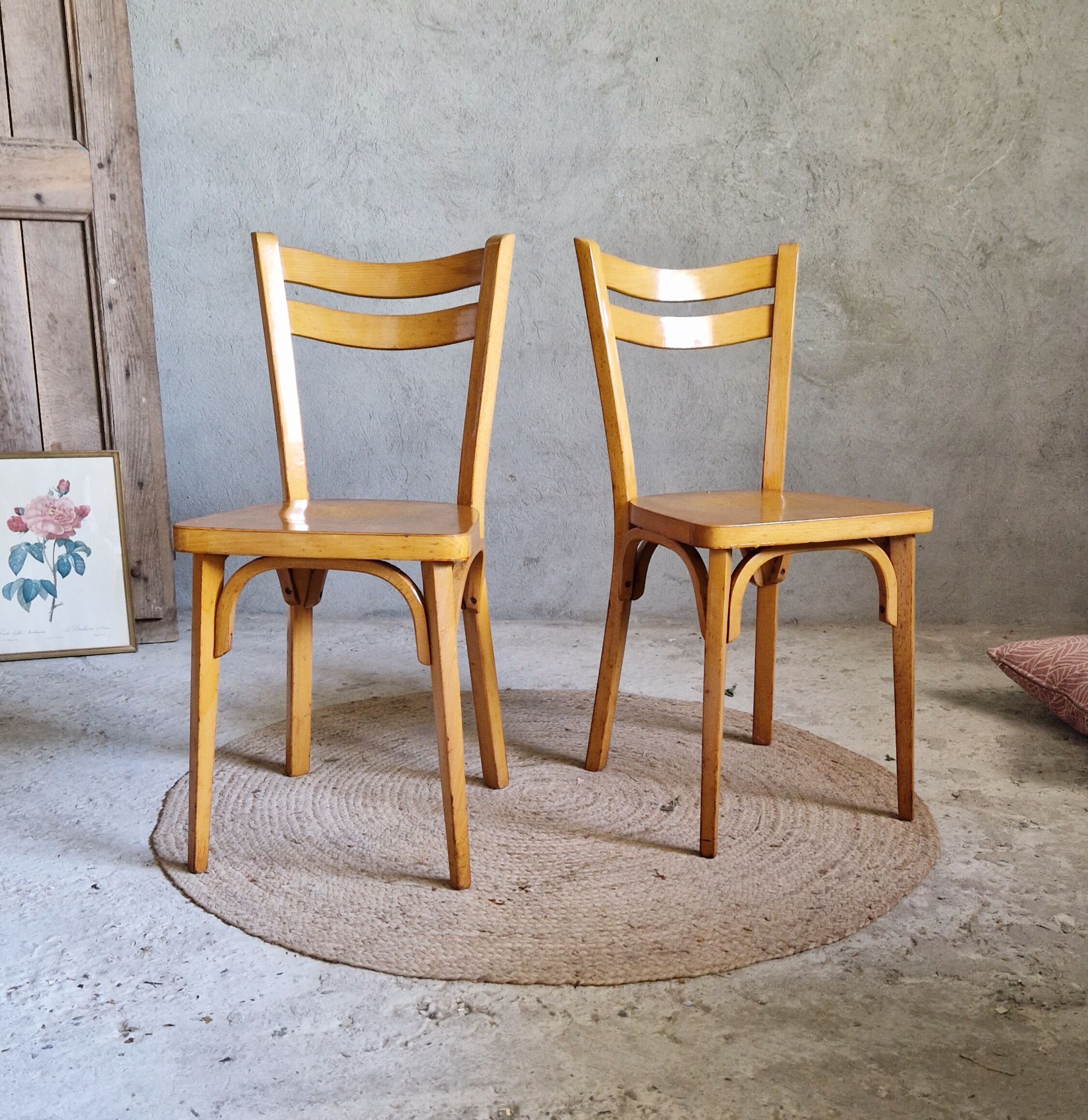 Old and pretty pair of Baumann bistro chairs