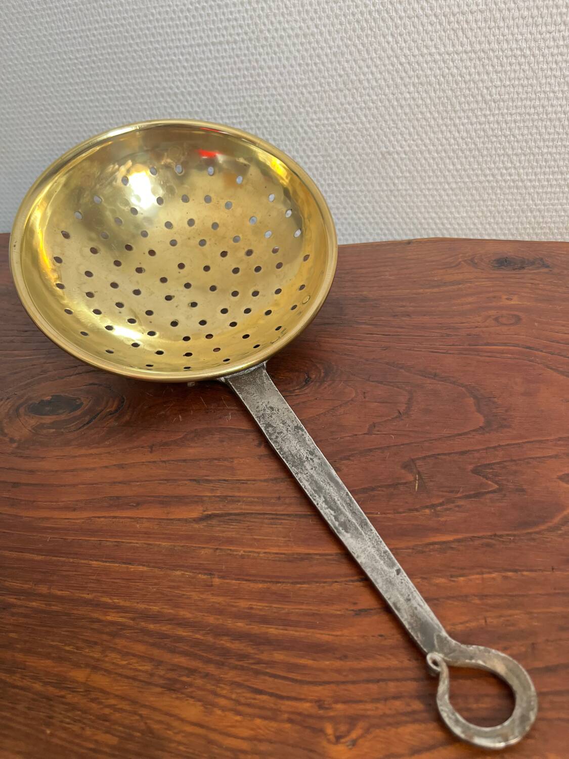 Large skimmer in brass and wrought iron, early 20th century