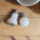 Duo of art deco wall lamps in porcelain and opaline