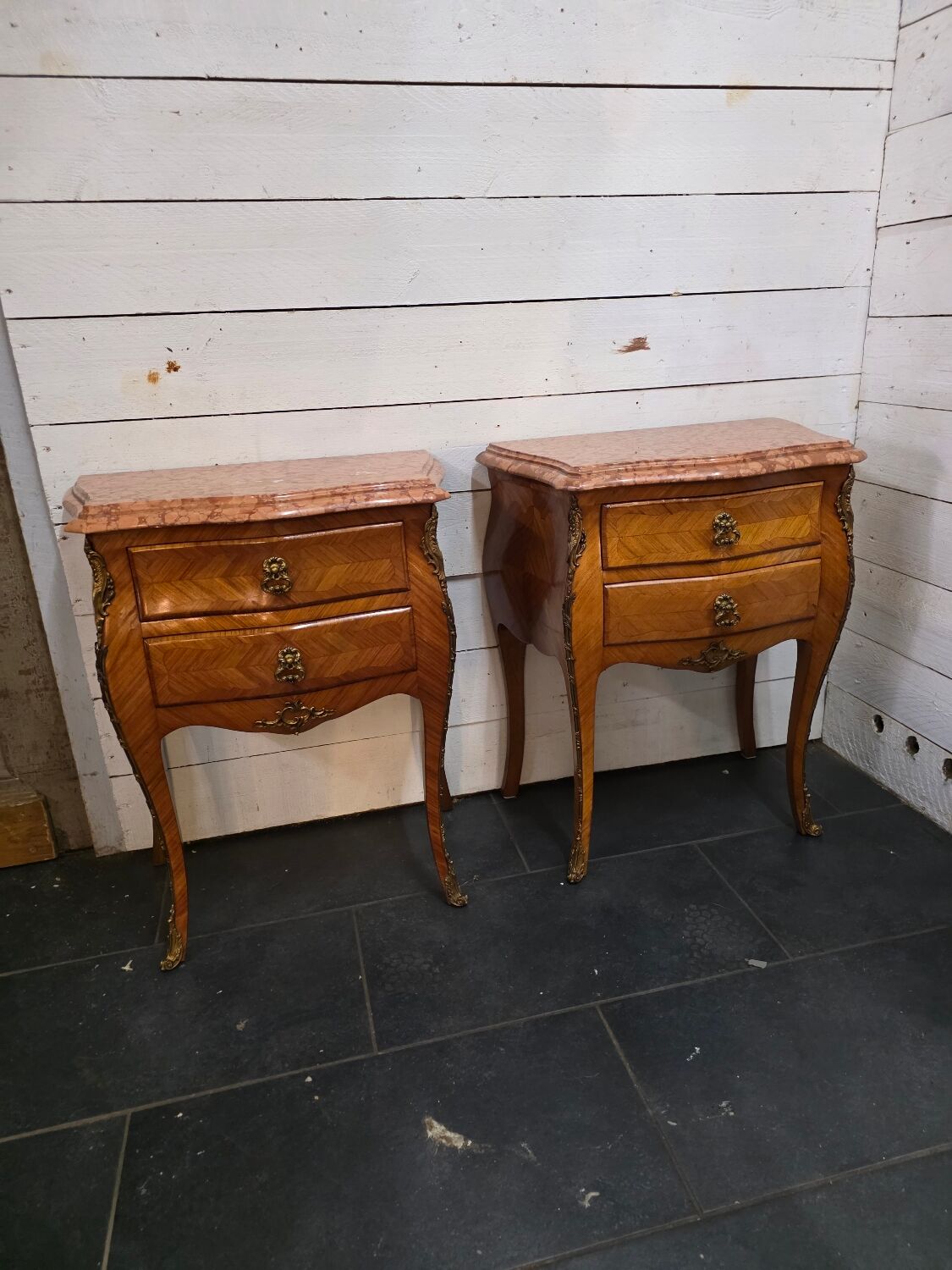 Pair of Louis XV style curved bedside tables in marquetry