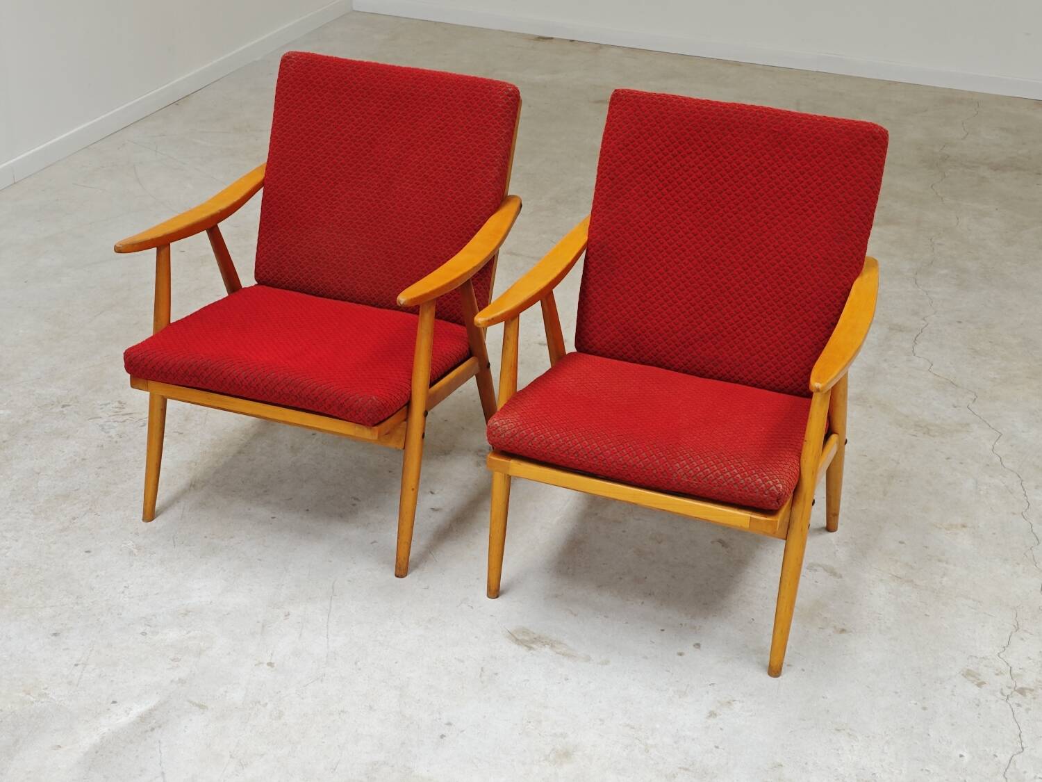 Pair of red Boomerang armchairs by Antonin Suman for Ton Bystrice Thonet
