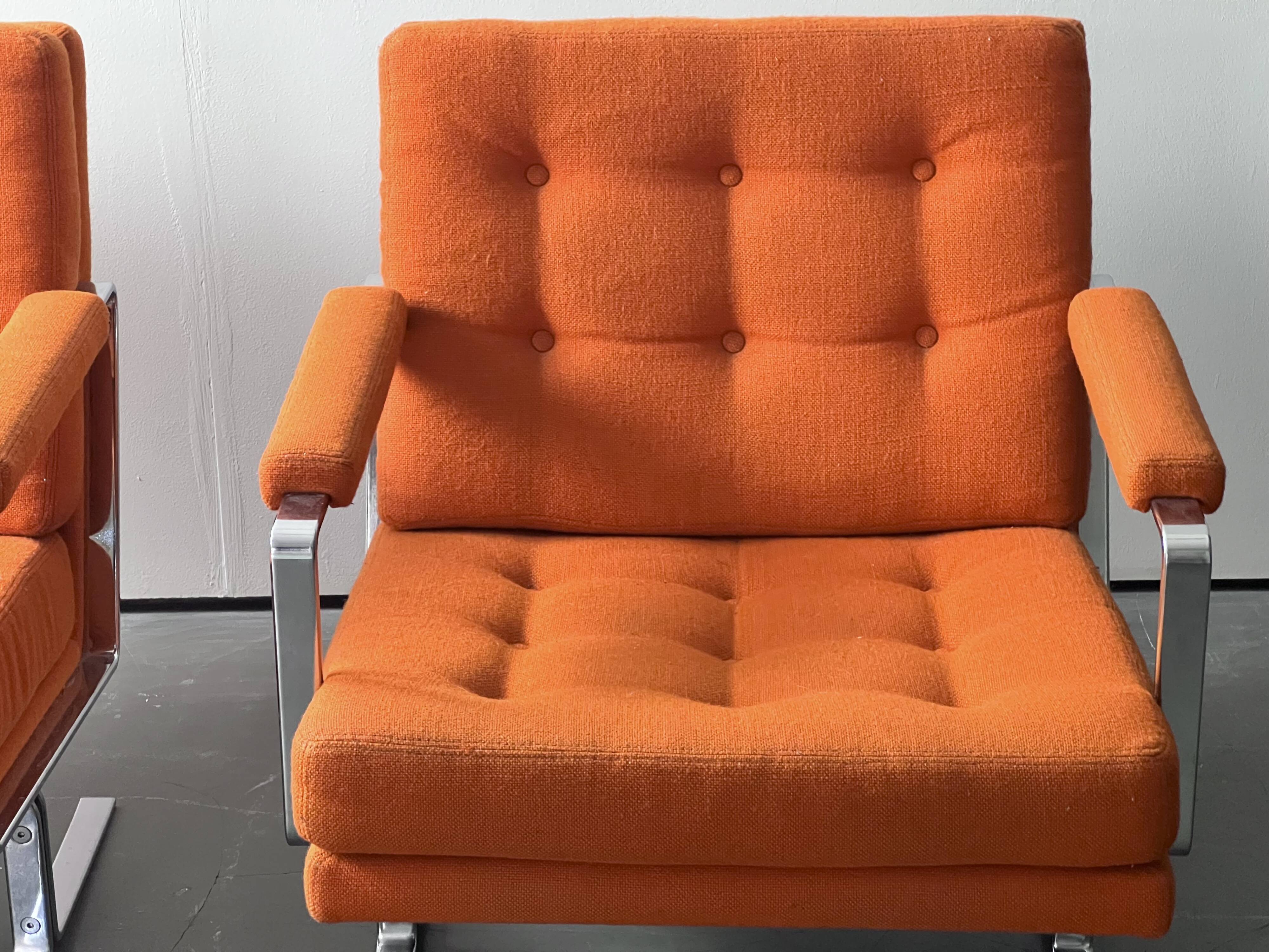 Pair of Karl Erik Ekselius armchair, in orange and chrome Kadrat fabric