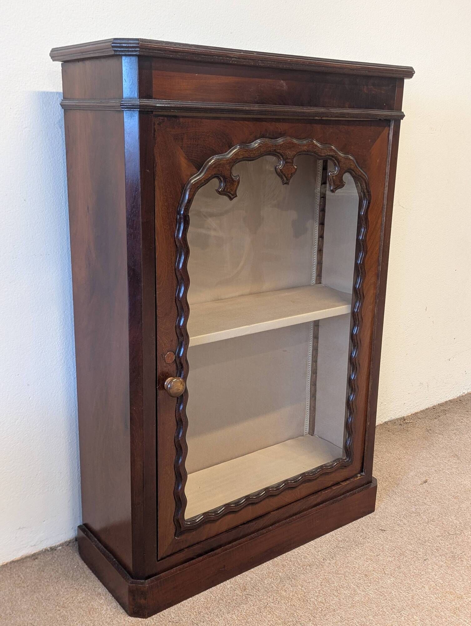 Mahogany display cabinet from the late 19th century, for standing or wall mounting.