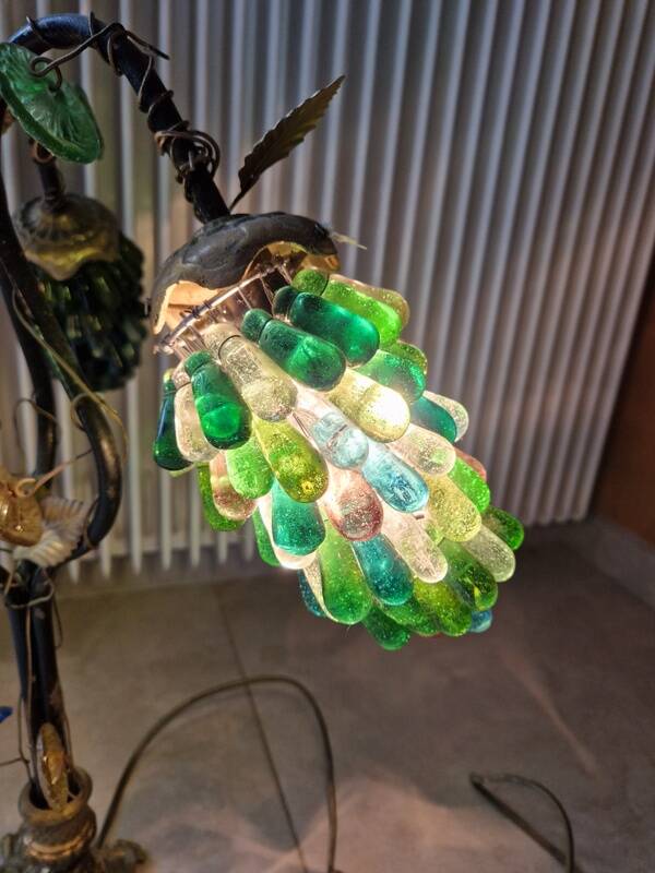 Bronze table lamp and Murano glass grape clusters.