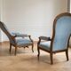Pair of Louis XV reclining Voltaire armchairs in blue fabric.