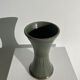 Dark green handcrafted vase with glazed ceramic grass blades