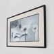 Framed painting with gray flower decor.
