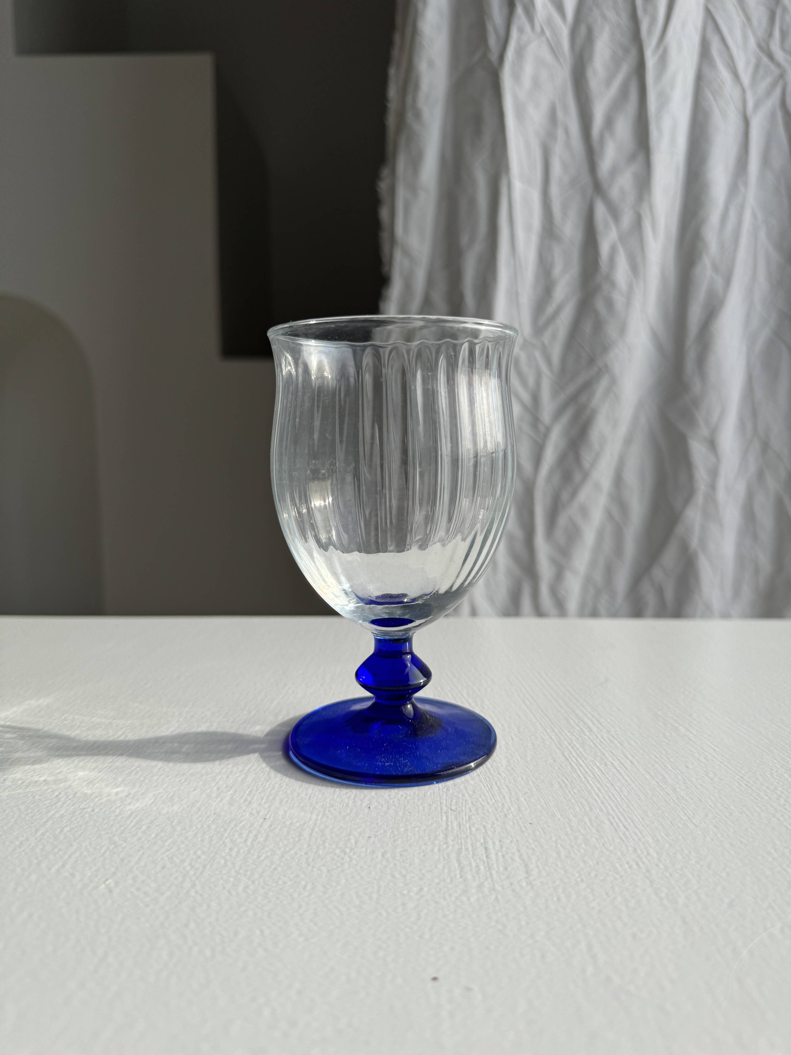 Set of 3 large blue stemmed glasses and 3 small blue stemmed glasses