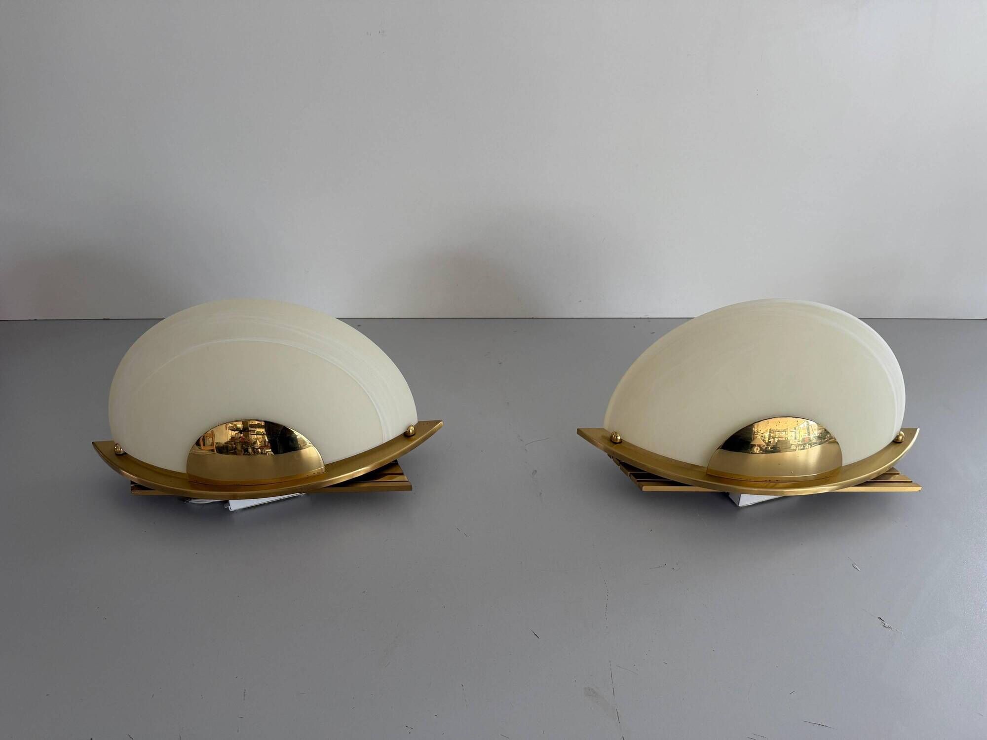 Pair of brass and glass wall lights from the Spage era, 1980, Germany.