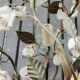 Italian cage chandelier decorated with ceramic roses and glass paste pendants