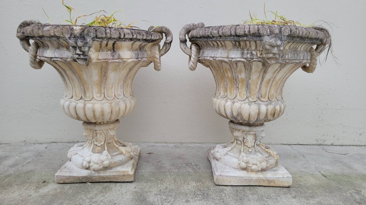 Pair of planter vases decorated with faces in reconstituted stone 1950s