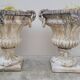 Pair of planter vases decorated with faces in reconstituted stone 1950s