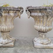 Pair of planter vases decorated with faces in reconstituted stone 1950s