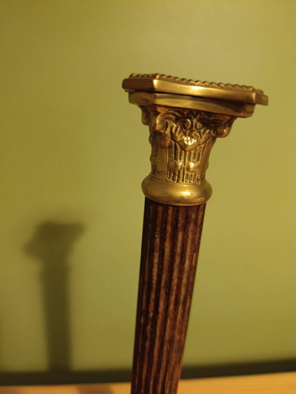 Golden brass candlestick, Corinthian style, vintage