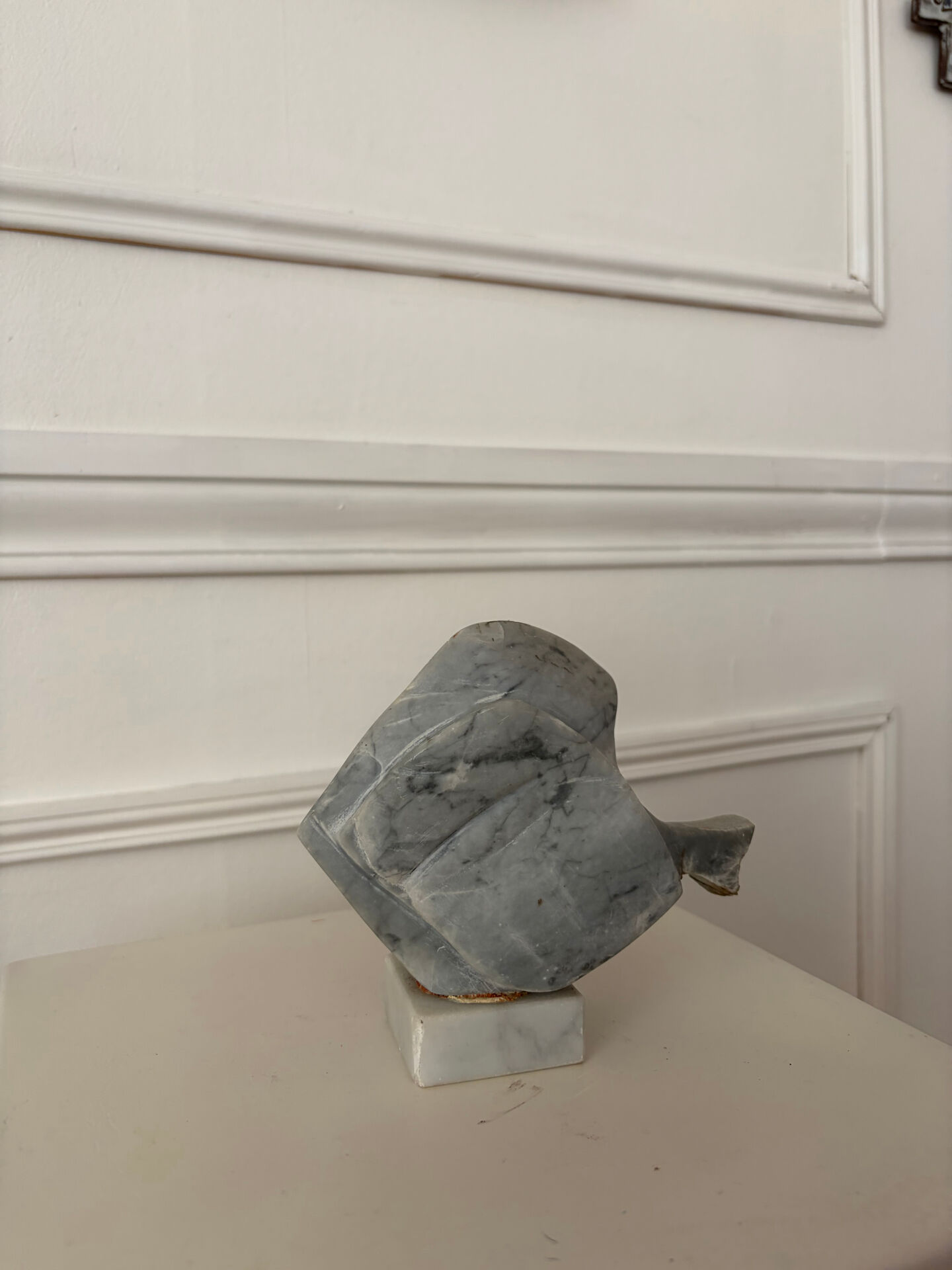 Marble sculpture in the shape of a fish.