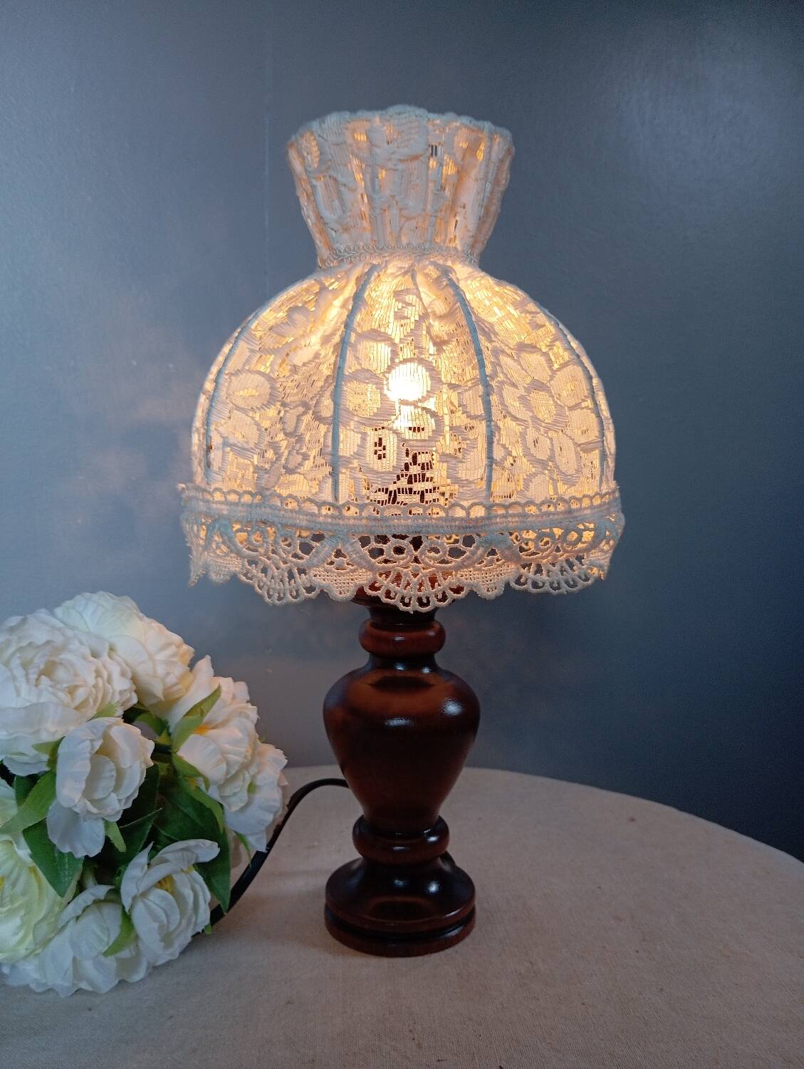 Table lamp with romantic wood and lace ambiance, retro chic