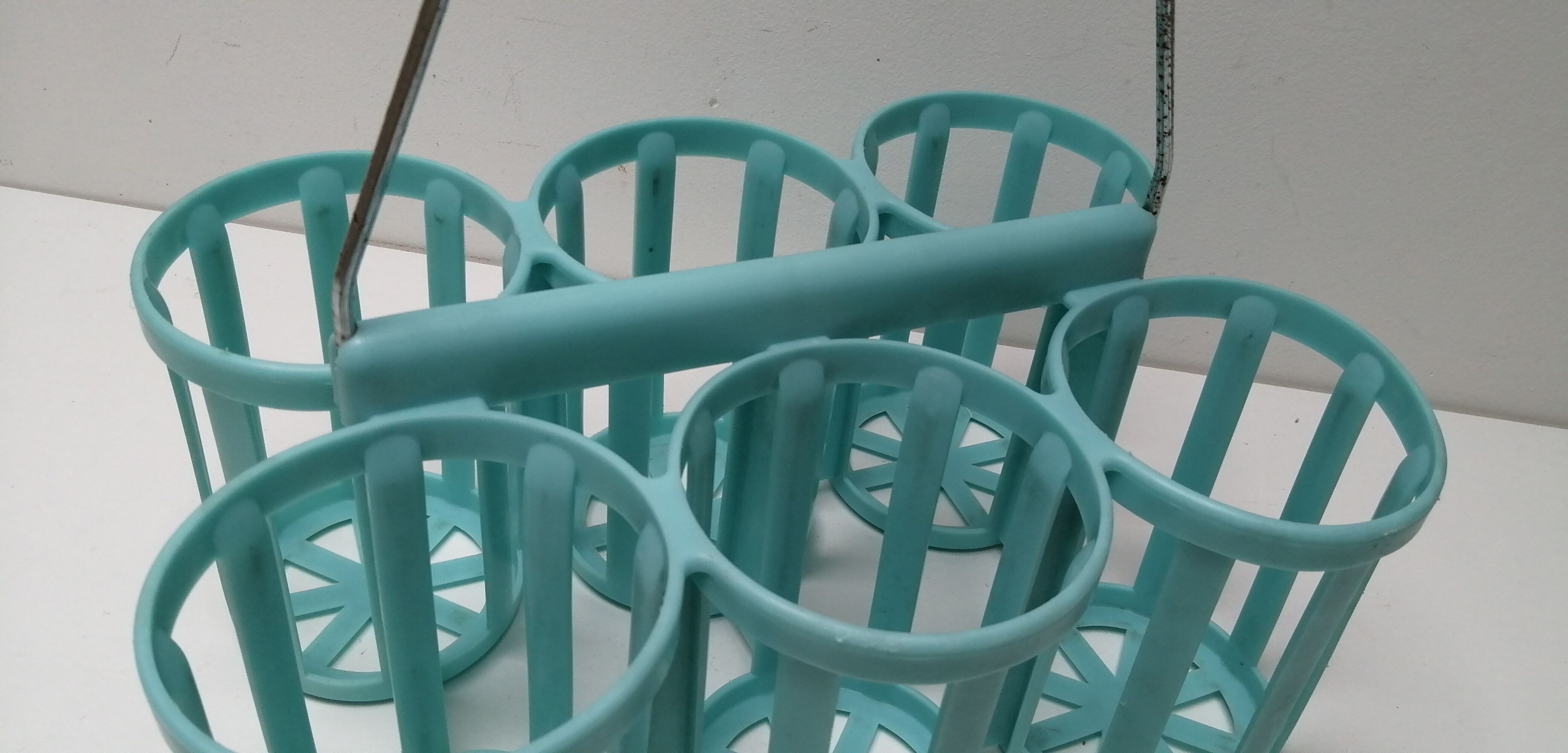 Vintage blue plastic bottle holder