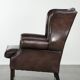 Dark brown cowhide Chesterfield wingback armchair in classic English style