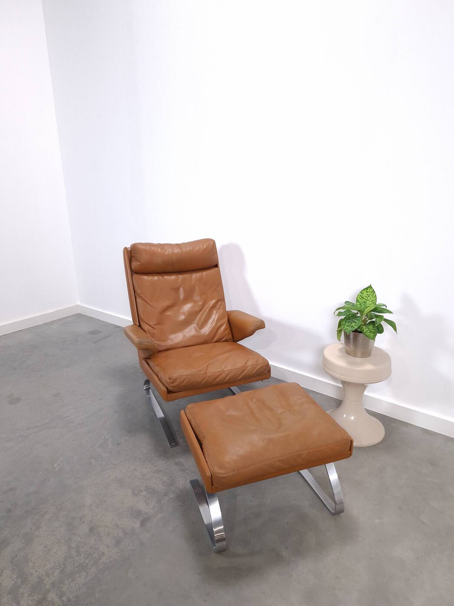 Vintage COR Swing armchair with ottoman, Reinhold Adolf, cognac leather