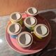 6 small porcelain cream pots from Limoges with a tray.
