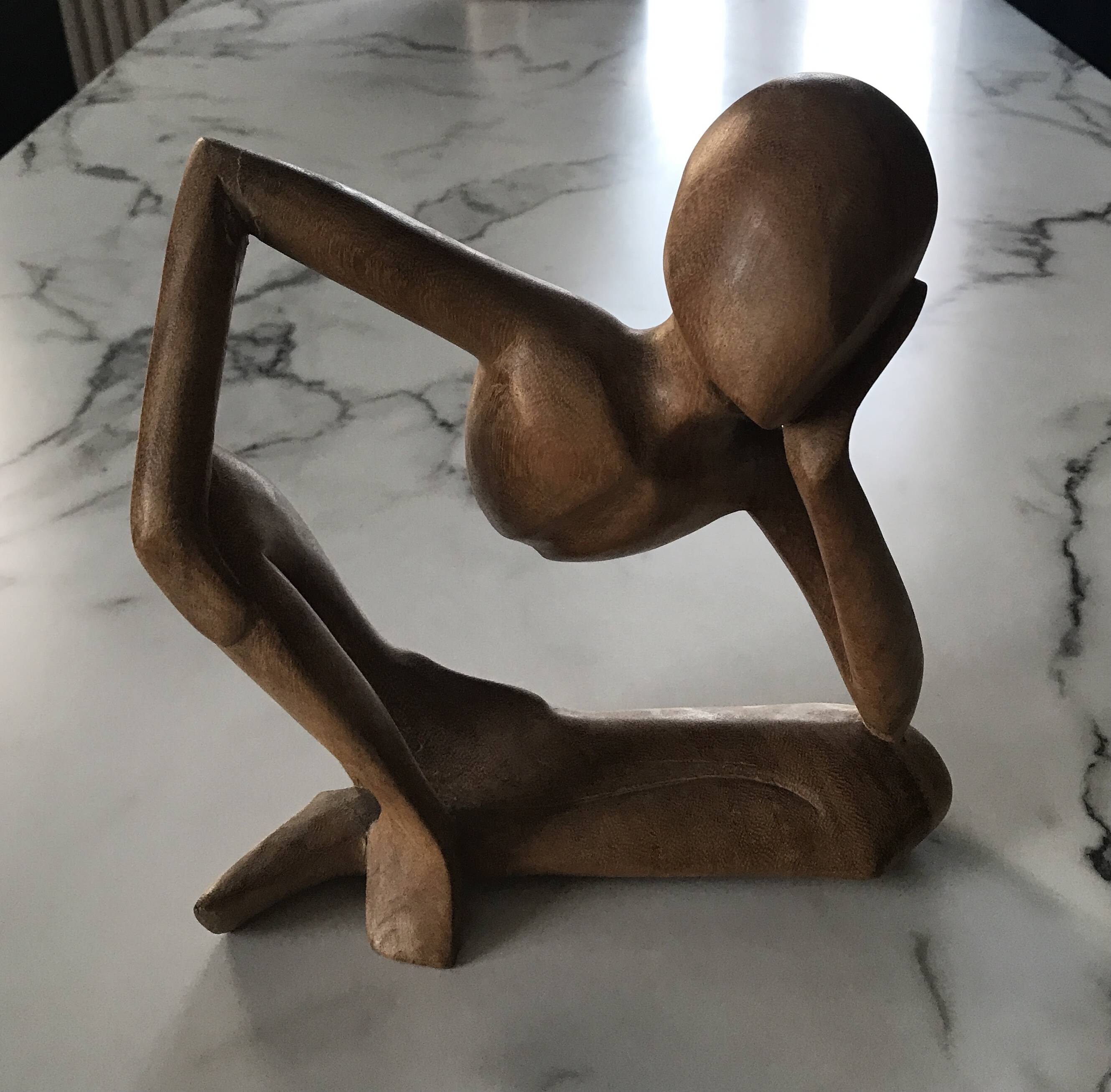 Pensive man wooden statue