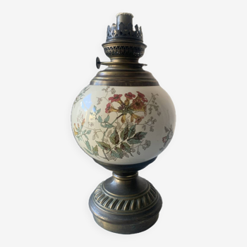 Old oil lamp with flower decor