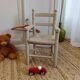 Grey patinated children's armchair with straw seat