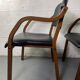 Paire de fauteuils en cuir et bois