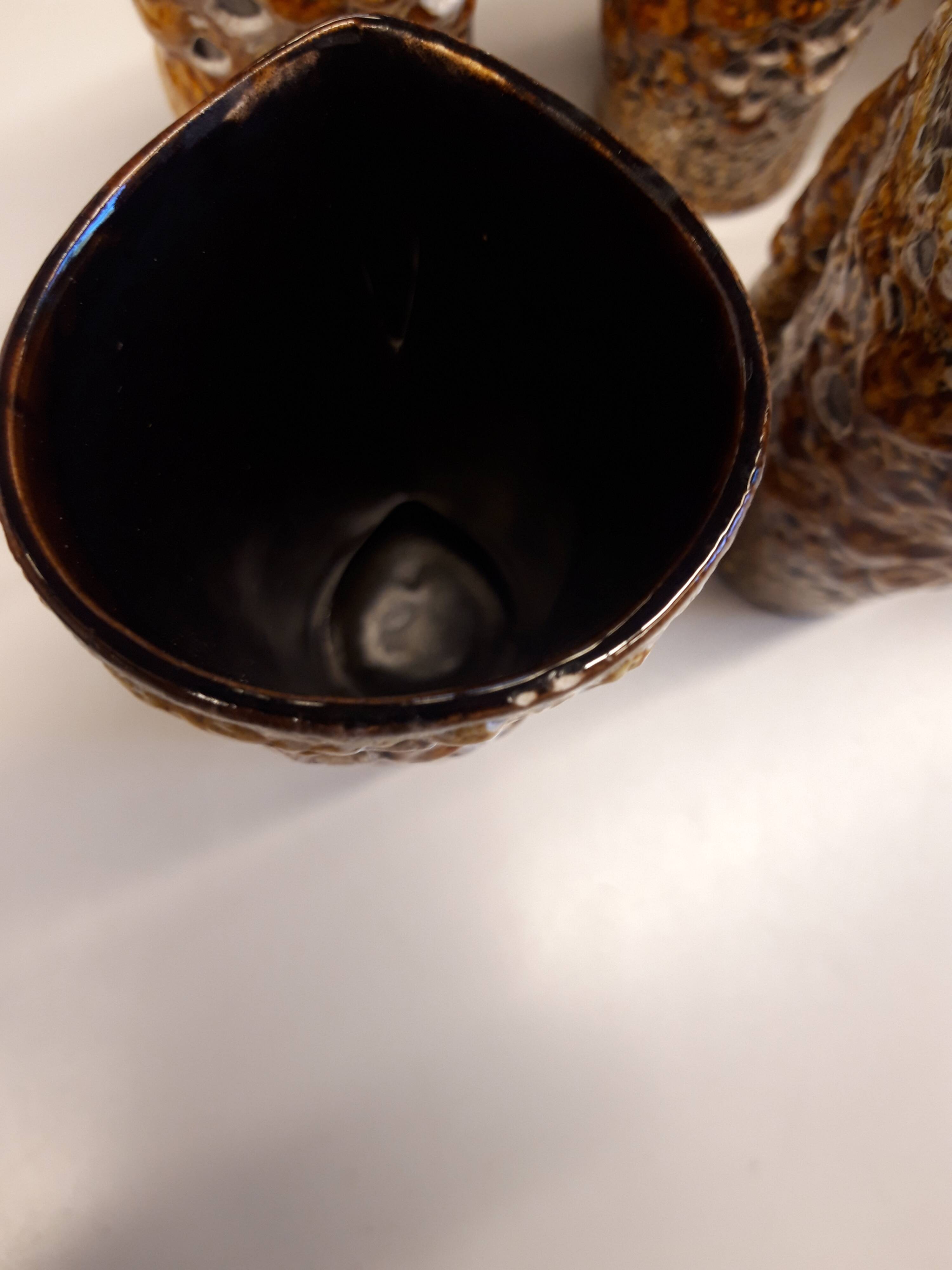 Set of 8 glazed ceramic mugs